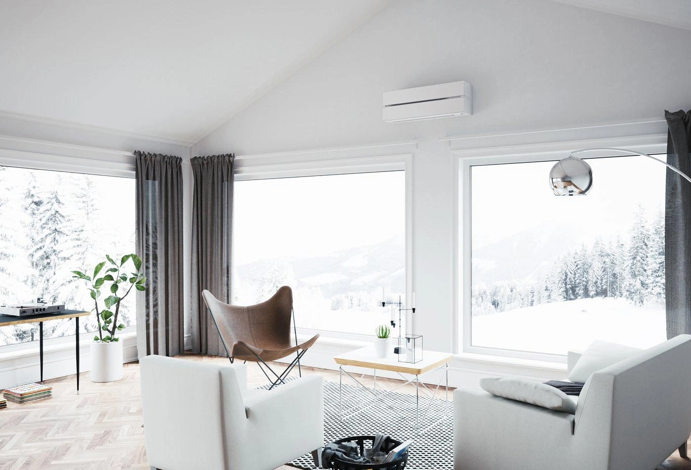 Minimalistiskt vardagsrum med utsikt över snötäckt vinterlandskap och fjäll.